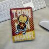 spinning element on the cover, showcasing iconic MRVL superheroes: Captain America, Iron Man, and Spider-Man.