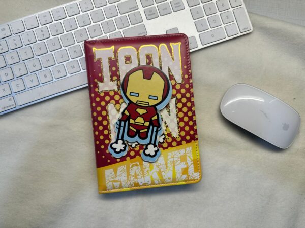 spinning element on the cover, showcasing iconic MRVL superheroes: Captain America, Iron Man, and Spider-Man.