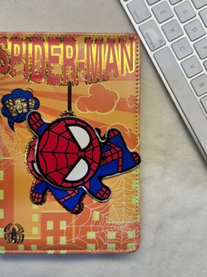 spinning element on the cover, showcasing iconic MRVL superheroes: Captain America, Iron Man, and Spider-Man.